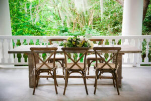 Wooden chairs with big flower center piece
