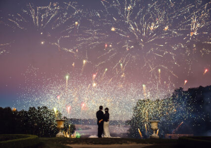 Newlywed couple watching fireworks
